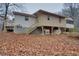 Back view of the house, highlighting its back porch and screened-in area at 5520 Hearn Rd, Ellenwood, GA 30294