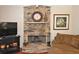 Inviting stone fireplace creates a cozy atmosphere at 6425 Riley Manor Way, Cumming, GA 30028