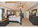 Spacious main bedroom with tray ceiling and plush carpeting at 6425 Riley Manor Way, Cumming, GA 30028