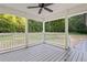 Covered back porch overlooking a wooded backyard at 8658 Knox Bridge Hwy, Canton, GA 30114