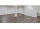 Unfinished basement with neutral walls and hardwood floors at 8658 Knox Bridge Hwy, Canton, GA 30114