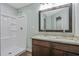 Bathroom with a shower, double vanity, and granite countertop at 8658 Knox Bridge Hwy, Canton, GA 30114