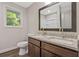 Bathroom with double vanity, granite countertop, and a shower at 8658 Knox Bridge Hwy, Canton, GA 30114