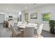 Bright dining room with round table and gray chairs, adjacent to kitchen at 8658 Knox Bridge Hwy, Canton, GA 30114