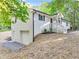 White brick home with attached garage and a covered porch at 8658 Knox Bridge Hwy, Canton, GA 30114