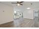 Bright living room with hardwood floors and a view to the kitchen at 8658 Knox Bridge Hwy, Canton, GA 30114