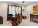 Bedroom with crib, desk and plenty of natural light at 1013 Lenox Valley Ne Dr, Atlanta, GA 30324