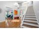 Bright and airy entryway with hardwood floors and elegant staircase at 1013 Lenox Valley Ne Dr, Atlanta, GA 30324