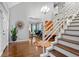 Entryway with hardwood floors, a circular rug, and staircase at 1013 Lenox Valley Ne Dr, Atlanta, GA 30324