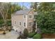 Two-story home, three-car garage, and lush landscaping at 1013 Lenox Valley Ne Dr, Atlanta, GA 30324