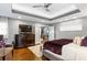 Spacious main bedroom with hardwood floors and a large TV at 1013 Lenox Valley Ne Dr, Atlanta, GA 30324