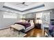 King-size bed and ensuite bathroom access in this luxurious main bedroom at 1013 Lenox Valley Ne Dr, Atlanta, GA 30324