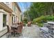 Stone patio with seating area and outdoor kitchen at 1013 Lenox Valley Ne Dr, Atlanta, GA 30324