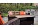 Comfortable patio furniture next to outdoor kitchen at 1013 Lenox Valley Ne Dr, Atlanta, GA 30324