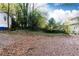 Large backyard with gravel and trees at 1252 Mclendon Ne Ave, Atlanta, GA 30307