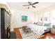 Large bedroom with hardwood floors, ceiling fan, and king-size bed at 1252 Mclendon Ne Ave, Atlanta, GA 30307