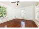 Well-lit bedroom with hardwood floors and multiple windows at 1252 Mclendon Ne Ave, Atlanta, GA 30307