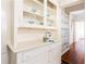 White built-in hutch with glass doors and drawers, offering ample storage at 1252 Mclendon Ne Ave, Atlanta, GA 30307