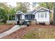 Charming two-story home with stone accents and a well-manicured lawn at 1252 Mclendon Ne Ave, Atlanta, GA 30307