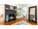 Black brick fireplace with decorative accents in a bright living room at 1252 Mclendon Ne Ave, Atlanta, GA 30307