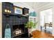 Stunning black brick fireplace as a focal point in the living room at 1252 Mclendon Ne Ave, Atlanta, GA 30307