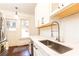 Modern kitchen with white cabinets, quartz countertops, and a stainless steel sink at 1252 Mclendon Ne Ave, Atlanta, GA 30307