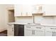 Modern kitchen with white cabinets and quartz countertops at 1252 Mclendon Ne Ave, Atlanta, GA 30307