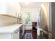 Updated kitchen with stainless steel appliances and white shaker cabinets at 1252 Mclendon Ne Ave, Atlanta, GA 30307