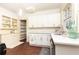 Modern kitchen with white cabinets, quartz countertops, and a pantry at 1252 Mclendon Ne Ave, Atlanta, GA 30307