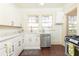 Modern kitchen with white cabinets, quartz counters, and stainless steel appliances at 1252 Mclendon Ne Ave, Atlanta, GA 30307