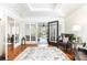 Bright living room with hardwood floors, coffered ceiling, and French doors at 1252 Mclendon Ne Ave, Atlanta, GA 30307