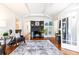 Living room with hardwood floors, fireplace, and built-in shelving at 1252 Mclendon Ne Ave, Atlanta, GA 30307