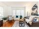 Bright living room with hardwood floors, bay window, and comfy seating at 1252 Mclendon Ne Ave, Atlanta, GA 30307