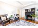 Elegant living room featuring hardwood floors, fireplace, and comfy armchairs at 1252 Mclendon Ne Ave, Atlanta, GA 30307