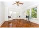 Sunlit living room with hardwood floors and built-in window seat at 1252 Mclendon Ne Ave, Atlanta, GA 30307