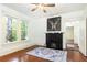 Living room with hardwood floors, fireplace, and large windows at 1252 Mclendon Ne Ave, Atlanta, GA 30307