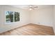 Well-lit bedroom with ceiling fan and wood-look floors at 2088 E Cherokee Dr, Woodstock, GA 30188