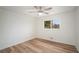 Spacious bedroom with hardwood floors and ceiling fan at 2088 E Cherokee Dr, Woodstock, GA 30188