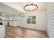 Open concept dining room with chandelier and kitchen access at 2088 E Cherokee Dr, Woodstock, GA 30188