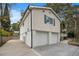 Two-car garage with a concrete driveway at 2088 E Cherokee Dr, Woodstock, GA 30188