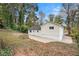 Exterior view of a renovated house with a large backyard at 2088 E Cherokee Dr, Woodstock, GA 30188