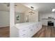 Modern kitchen with white cabinets and quartz countertops at 2088 E Cherokee Dr, Woodstock, GA 30188