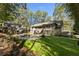 Large backyard with a view of the home and pool area at 315 Brandenburgh Cir, Roswell, GA 30075