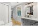 Modern bathroom with gray vanity and quartz countertop at 315 Brandenburgh Cir, Roswell, GA 30075