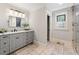 Bathroom with gray vanity, tile flooring and a walk-in shower at 315 Brandenburgh Cir, Roswell, GA 30075