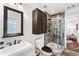 Updated bathroom with a walk-in shower and dark vanity at 315 Brandenburgh Cir, Roswell, GA 30075