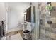 Modern bathroom with walk-in shower and tile floors at 315 Brandenburgh Cir, Roswell, GA 30075