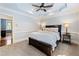 Spacious bedroom with carpeted floors and a ceiling fan at 315 Brandenburgh Cir, Roswell, GA 30075