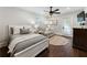 Bright bedroom with comfy bed, sofa, and hardwood floors at 315 Brandenburgh Cir, Roswell, GA 30075