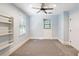 Bright bedroom with built-in shelving and ceiling fan at 315 Brandenburgh Cir, Roswell, GA 30075